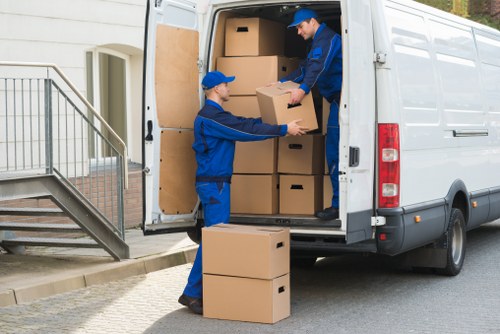 Professional movers handling flat removals in Shoreditch on a busy city street