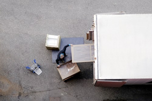Workers loading separated recycling at a transfer station